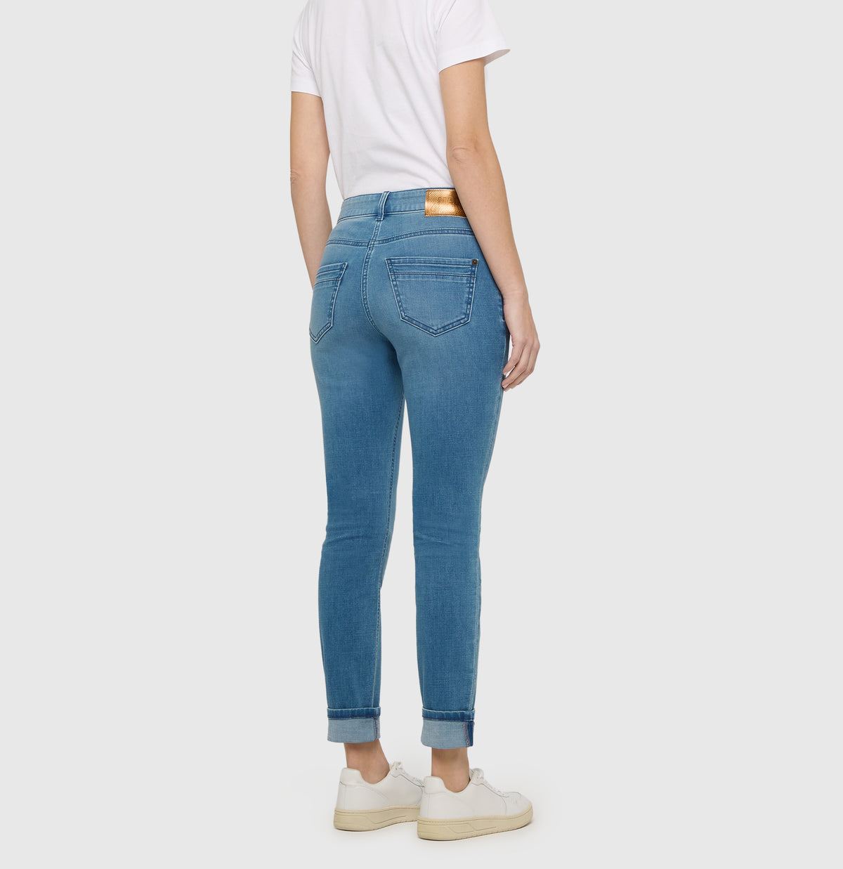 Slim jeans in a light cotton-modal blend. | RICH SLIM | authentic cobalt used | Back view of model