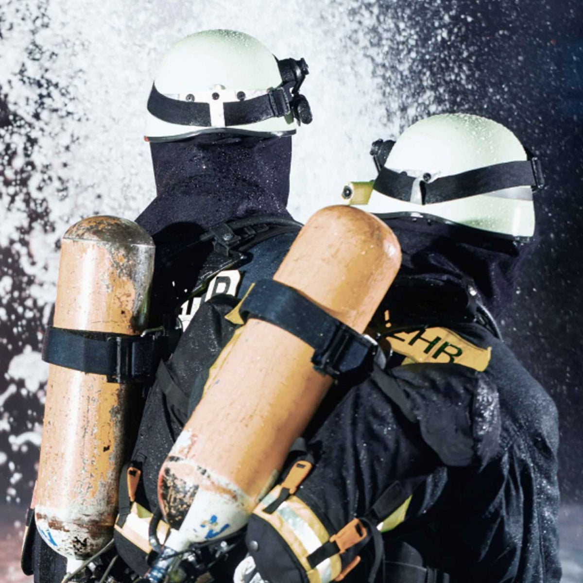 Firefighters wearing protective gear during an emergency response scene.