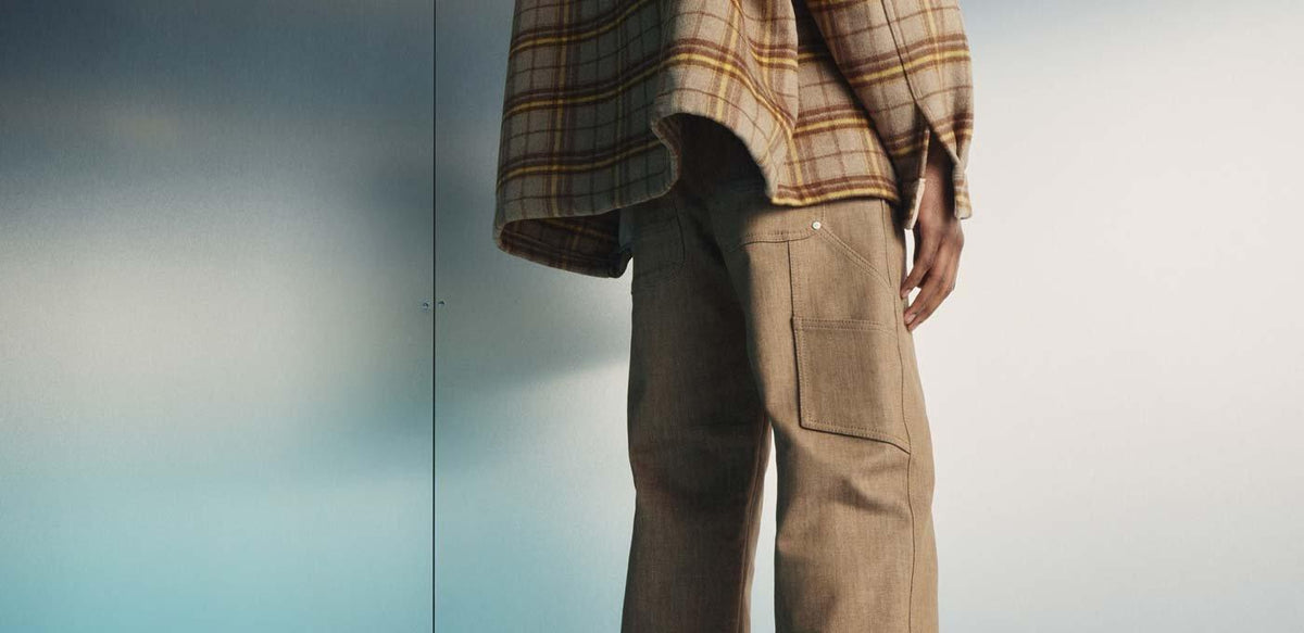 Close-up of MAC trousers highlighting fabric texture and utility pocket details.